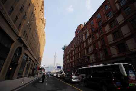 An outside look of both sides of the Shanghai Peace Hotel is seen in this photo taken in Shanghai, the economic and financial hub of China, Dec. 17, 2009.