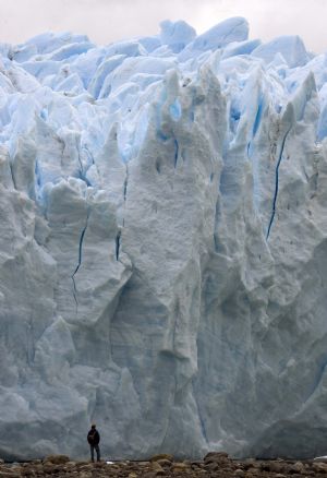 A climber stands in front of Argentina&apos;s Perito Moreno glacier near the city of El Calafate, in the Patagonian province of Santa Cruz, December 16, 2009.