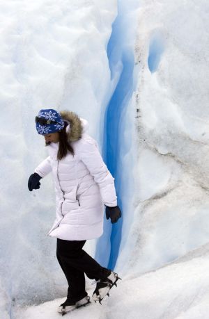 A climber treks next to a crack on Argentina&apos;s Perito Moreno glacier near the city of El Calafate, in the Patagonian province of Santa Cruz, December 16, 2009.