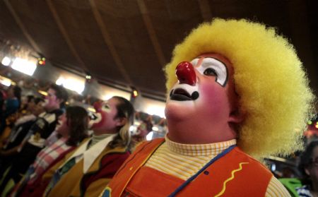 Clowns attend a mass during an annual pilgrimage at the Basilica of Guadalupe in Mexico City December 16, 2009. About 600 clowns took part in the annual event to thank the Virgin of Guadalupe for helping them find work through the year, according to local media.