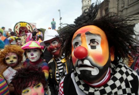 Clowns take part in an annual pilgrimage outside at the Basilica of Guadalupe in Mexico City December 16, 2009. About 600 clowns took part in the annual event to thank the Virgin of Guadalupe for helping them find work through the year, according to local media.