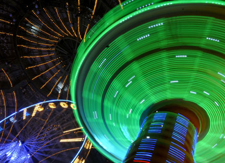 A merry-go-round turns at a funfair inside Paris&apos; Grand Palais as part of holiday activities in the French capital December 17, 2009. The fair opens on December 18 and will run until January 1.