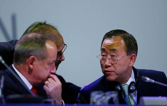 UN's Secretary General Ban Ki-Moon (R) talks with UN Climate chief de Boer during a night plenary meeting at the United Nations Climate Change Conference (COP15) at the Bella Center in Copenhagen, December 19, 2009.The UN climate change conference failed to adopt the Copenhagen Accord on Dec. 19.