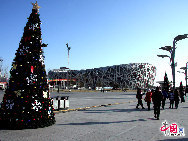 The operator of China's National Stadium, or the 'Bird's Nest', announced Saturday that 25,000 tons of snow for the Beijing Olympic stadium's first snow season carnival were made from harmless intermediate water. [Photo by YZ]