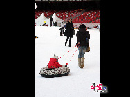 The operator of China's National Stadium, or the 'Bird's Nest', announced Saturday that 25,000 tons of snow for the Beijing Olympic stadium's first snow season carnival were made from harmless intermediate water. [Photo by YZ]