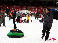 The operator of China's National Stadium, or the 'Bird's Nest', announced Saturday that 25,000 tons of snow for the Beijing Olympic stadium's first snow season carnival were made from harmless intermediate water. [Photo by YZ]