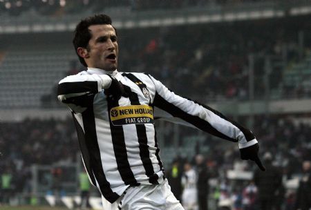 Juventus&apos; Hasan Salihamidzic celebrates after scoring against Catania during their Italian Serie A soccer match at the Olympic stadium in Turin December 20, 2009.