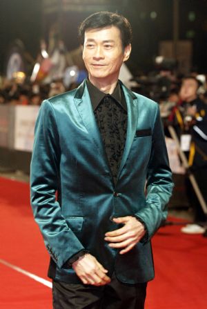 Chinese Hong Kong actor Adam Cheng walks on the Star Boulevardduring the awarding ceremony held at the I-Sho University in Kaoshiung of southeast China&apos;s Taiwan Province on Dec. 19, 2009. The 53rd Asia Pacific Film Festival attracted 58 films from 14 nations and regions who are members of this regional film festival. Some 500 delegates took part in the award-presentation ceremony. (Xinhua)