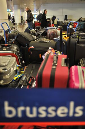 Photo taken on Dec. 20, 2009 shows luggage at an airport in Brussels, capital of Belgium. Snowstorms hit large areas of Europe in recent days, impacting highway, railway and air traffic. The Brussels airport was closed due to heavy snow, causing a number of passengers stayed here. (Xinhua/Wu Wei)