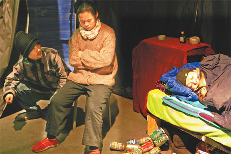 In a scene of The Magic Storybox Experience, Xiao Chao (right) tries to sleep while his parents, who are migrant workers, argue.