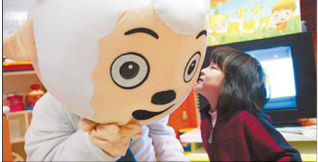 A girl kisses Pleasant Goat, a character from the animated series,” Pleasant Goat and Big Big Wolf', at a theater in Beijing. The animation industry is thriving in China. [CFP]