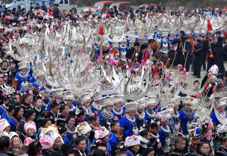 People of the Miao ethnic group perform traditional dance during the closing celebration of the Guzang Festival at Wuliu Village in Leishan County, southwest China&apos;s Guizhou Province, Dec. 19, 2009. The Guzang Festival, one of the grandest festivals of the Miao ethnic group to commemorate their ancestors, was held here from Nov. 27 to Dec. 19. (Xinhua/Chen Peiliang)