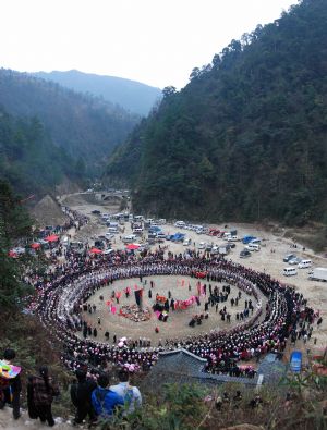 People of the Miao ethnic group perform traditional dance during the closing celebration of the Guzang Festival at Wuliu Village in Leishan County, southwest China&apos;s Guizhou Province, Dec. 19, 2009. The Guzang Festival, one of the grandest festivals of the Miao ethnic group to commemorate their ancestors, was held here from Nov. 27 to Dec. 19. (Xinhua/Chen Peiliang)