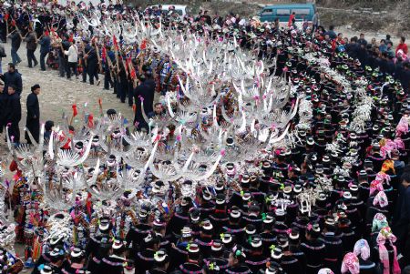 People of the Miao ethnic group perform traditional dance during the closing celebration of the Guzang Festival at Wuliu Village in Leishan County, southwest China&apos;s Guizhou Province, Dec. 19, 2009. The Guzang Festival, one of the grandest festivals of the Miao ethnic group to commemorate their ancestors, was held here from Nov. 27 to Dec. 19. (Xinhua/Chen Peiliang)