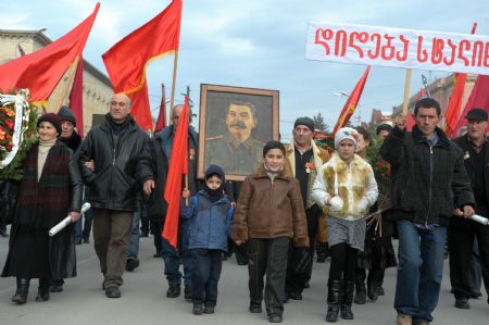 People attend the memorial ceremony marking the 130th anniversary of Josef Stalin&apos;s birthday in Gori, Georgia, Dec. 21, 2009. Some Georgians came to Gori, where Josef Stalin was born 130 years ago, to pay tribute to the Soviet leader on Monday.