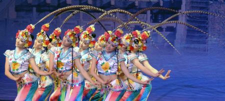 Performers form China&apos;s Hunan Province dance in Kuwait City Dec. 21, 2009.