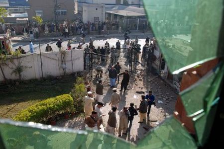 People gather at the site of blast in the northwestern Pakistani city of Peshawar, Dec. 22, 2009. 