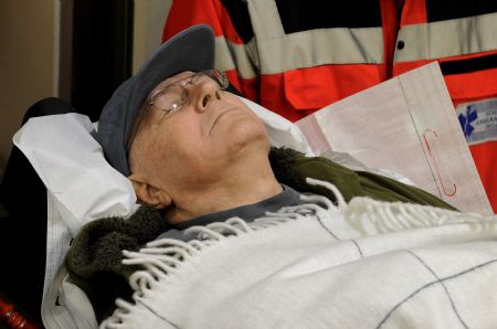 Accused Nazi death camp guard John Demjanjuk is brought in a courtroom in Munich December 22, 2009. The trial of Demjanjuk, an 89-year-old former U.S. auto worker, facing charges he helped force 27,900 Jews into gas chambers in Sobibor extermination camp in 1943, resumed on Monday. 