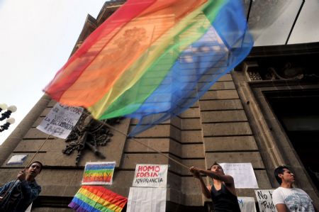 Gay rights activist cheer after a session at the city&apos;s assembly in Mexico City December 21, 2009. Mexico City&apos;s assembly voted to extend gay couples full marriage rights on Monday in a landmark law that is the first of its kind in Latin America, a traditionally macho and Catholic region. The bill takes a 2006 law allowing civil unions by allowing gay couples to access family social security benefits and apply for joint credits as if they were a straight couple.(Xinhua/AFP Photo)