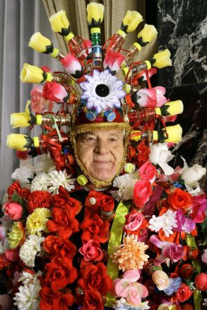 A man dressed in a costume attends the draw for the world