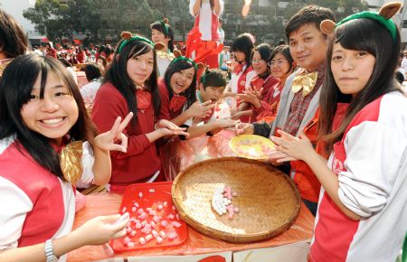 Students and teachers take part in an activity of making sweet soup dumplings at a middle school in Taipei, southeast China&apos;s Taiwan.