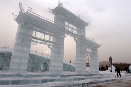 Technicians from Harbin, northeast China&apos;s Heilongjiang Province, work on an ice sculpture in Hexigten Qi in north China&apos;s Inner Mongolia Autonomous Region, Dec. 25, 2009. Over 30 ice sculpture makers from Harbin arrived in Hexigten Qi to set up an ice sculpture park.