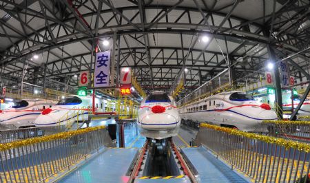 A high-speed train stops at the high-speed railway maintenance base in Wuhan, capital of central China's Hubei Province, Dec. 26, 2009.