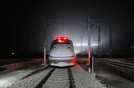 A high-speed train runs into Wuhan Railway Station, in Wuhan, capital of central China's Hubei Province, Dec. 26, 2009.
