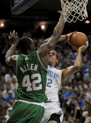 Orlando Magic forward Matt Barnes (R) shoots over Boston Celtics guard Tony Allen during second half NBA basketball action in Orlando, Florida December 25, 2009.