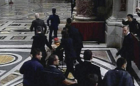 French Cardinal Roger Etchegaray on a wheelchair is taken to hospital at the Vatican City in this television frame grab December 24, 2009.