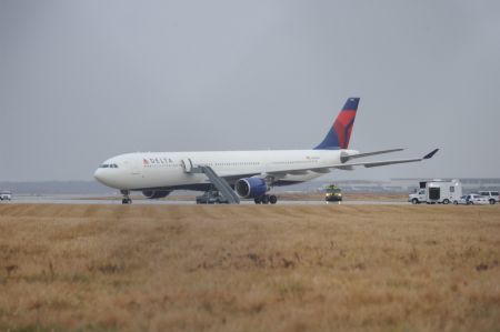 This picture shows Northwest Airlines Flight 253 on the runway after arriving at Detroit Metropolitan Airport from Amsterdam on Friday, Dec. 25, 2009. A passenger aboard the plane set off firecrackers Friday, causing a commotion and some minor injuries, a Delta official said.