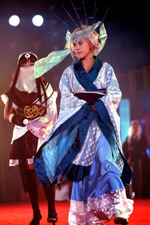 Contestants perform on the stage at the final of 2009 Cosplay Competition held in Guilin, southwest China's Guangxi Zhuang Autonomous Region, Dec. 25, 2009. Over 30 teams took part in the competition and competed for champion, prizes of best styling, best performing team and best property.