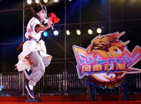 A contestant performs on the stage at the final of 2009 Cosplay Competition held in Guilin, southwest China's Guangxi Zhuang Autonomous Region, Dec. 25, 2009. Over 30 teams took part in the competition and competed for champion, prizes of best styling, best performing team and best property.