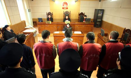 Criminal suspects stand on trial at the court for soccer corruption in Yixing of Jiangxi Province, China, Dec. 11, 2009.(Xinhua File Photo)