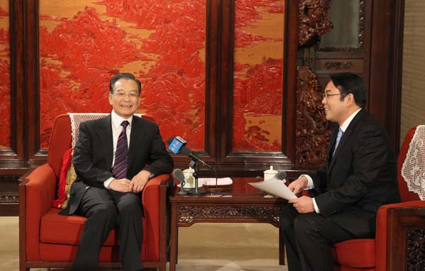 Chinese Premier Wen Jiabao speaks during an exclusive interview with Xinhua News Agency at Ziguangge building inside Zhongnanhai, an office compound of the Chinese central authorities at the heart of Beijing, Dec. 27, 2009. [Xinhua]