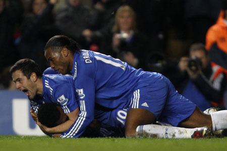 Chelsea's team players celebrate after scoring their second goal against Fulham during their English Premier League soccer match at Stamford Bridge in London December 28, 2009. 