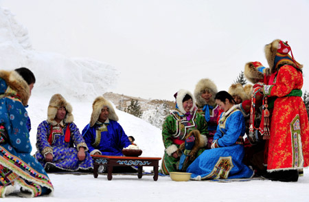 A traditional Ujimqin wedding ceremony is presented for tourists in Xi Ujimqin Qi, north China's Inner Mongolia Autonomous Region, on Dec. 28, 2009. (Xinhua/Ren Junchuan)