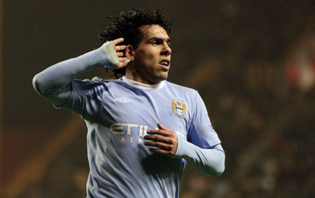 Manchester City's Carlos Tevez, reacts after scoring his team's third goal during their English Premier League soccer match against Wolverhampton Wanderers at the Molineux stadium, Wolverhampton England, Monday, Dec. 28, 2009.