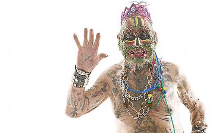 The man with the most body piercings is John Lynch, who was counted as having 241 piercings, including 151 in his head and neck, in Hammersmith, London, on 17 October 2008.(Photo Source: gb.cri.cn)