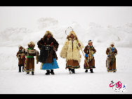 A winter Naadam festival featuring ice and snow was held at west Wuzhumuqin grassland, China's northern Inner Mongolia Autonomous Region on December 28, 2009. Fashion shows, Mongolian games, archery, wrestling and horse racing were major events highlighted at the Mongolian ethnic carnival. [Photo: china.org.cn] 