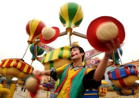 A clown performs for audience in a park in Changsha, capital of central China's Hunan Province, to celebrate the upcoming new year, Dec. 29, 2009. 