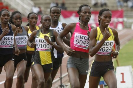 Kenya&apos;s Janeth Jepkosgei Busienei (R) runs to win the women&apos;s 800m race at the Nyayo stadium in Nairobi, July 25, 2009, during national trials to select the team for the Berlin World Championships next month. Kenya&apos;s Palmela Jelimo (2nd R) admitted she was under pressure to return to form from after being beaten by running mate Jepkosgei in the two-lap race at Kenyan trials on Saturday.[Xinhua/Reuters File Photo]