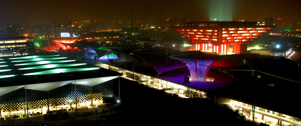 Photo taken on Dec. 30, 2009 shows the China Pavilion (R) and the Sunshine Valley, part of the main buildings of 2010 Shanghai World Expo Park, being set on trial readjustment of overall illumination, in Shanghai, east China&apos;s Metropolis. [CFP]