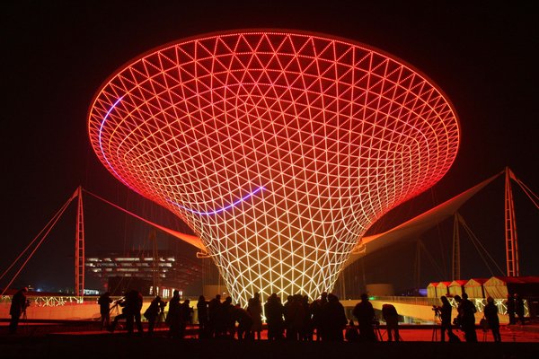 Photo taken on Dec. 30, 2009 shows the Sunshine Valley, one of the main buildings of 2010 Shanghai World Expo Park, being set on trial readjustment of overall illumination, in Shanghai, east China&apos;s Metropolis. [CFP]