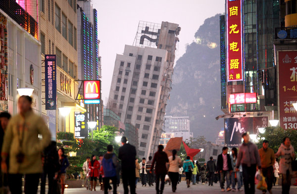 The other half of the complex is seen leaning after a failed demolition in Liuzhou, Guangxi Zhuang Autonomous Region on December 30, 2009.[CFP]