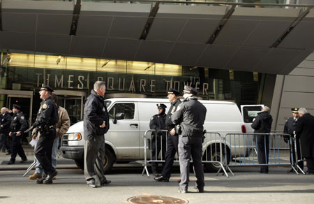 New York Police Department officers inspect a van that has been declared a "suspicious vehicle" and has caused numerous building evacuations and street closures near Times Square in New York December 30, 2009.