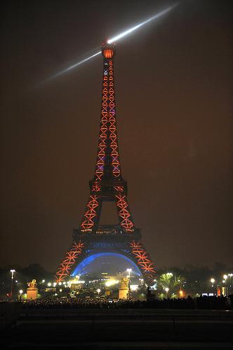 Picture taken on December 31, 2009 in Paris shows the Eiffel tower illuminated to celebrate the New Year's eve and mark the end of the 120th anniversary of the monument.