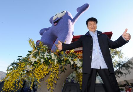 Chinese Hong Kong star Jackie Chan poses beside a Chinese float during a preview of the Tournament of Roses in Pasadena, California, the United States, on Dec. 31, 2009. Jackie Chan and Chinese basketball player Yao Ming came to Los Angeles to promote the Shanghai 2010 World Expo float, which is the first float ever made to appear at the Pasadena Rose Parade in the history of the World Expo.