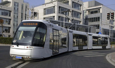 Shanghai's first modern streetcar line begins operation in the east China city on January 1, 2010. There are 15 stations along the 9.8-kilometer route with a flat ticket fare of 2 yuan. It connects with Shanghai Metro Line 2 at Zhangjiang High Tech station. [Photo/Xinhua]