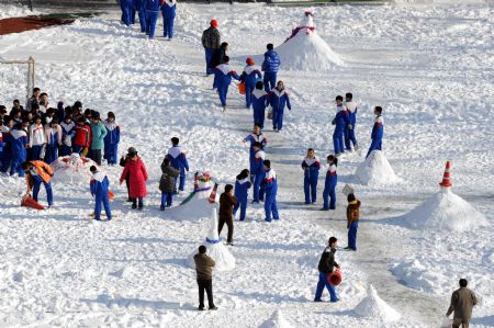 Students have fun on the playground during a break in a school in Beijing, China, Jan. 5, 2010. Classes in primary and secondary schools in Beijing resumed on Tuesday after a one-day suspension due to the heavy snowfall. (Xinhua